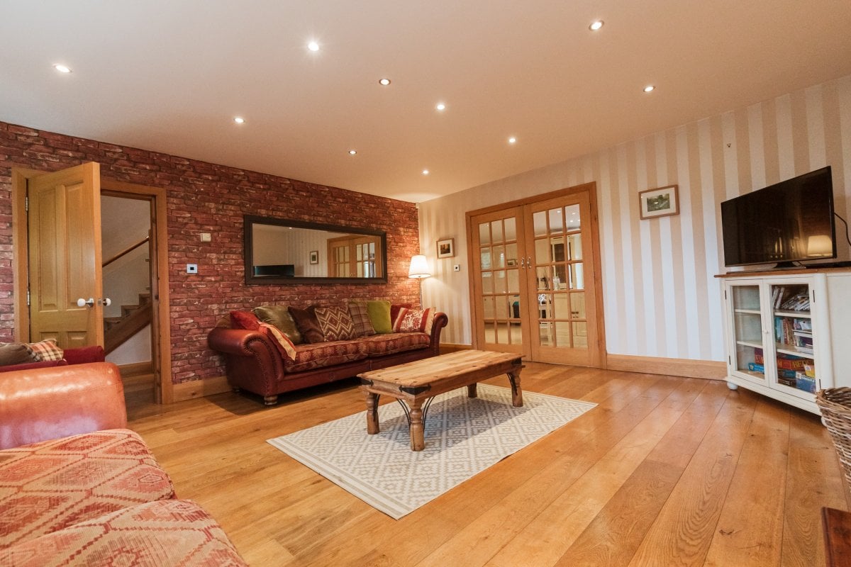 Woodfield Farm - comfortable sitting room with a wood burner